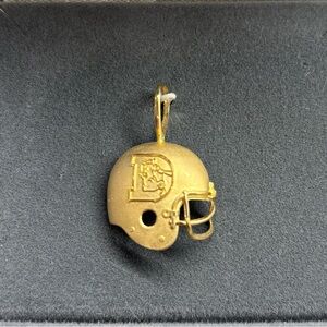 Denver Broncos gold helmet pendant.